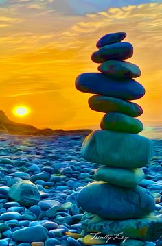 3e3ca12955864bedc97caf544060b078 Phần này có thể chứa: a stack of rocks sitting on top of a beach next to the ocean at sunset