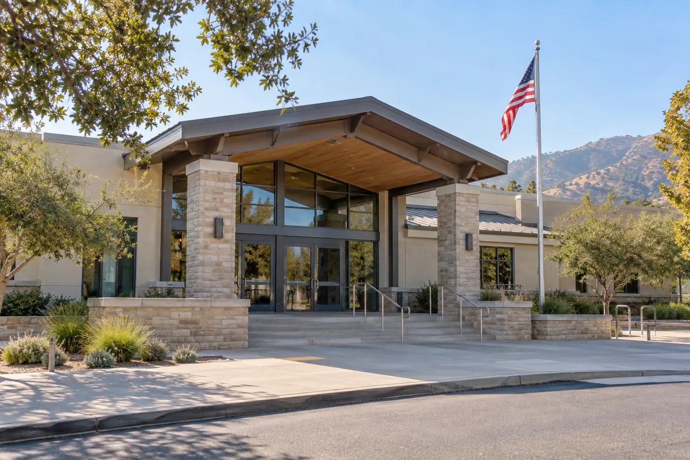 A generic California county public building with an American flag.