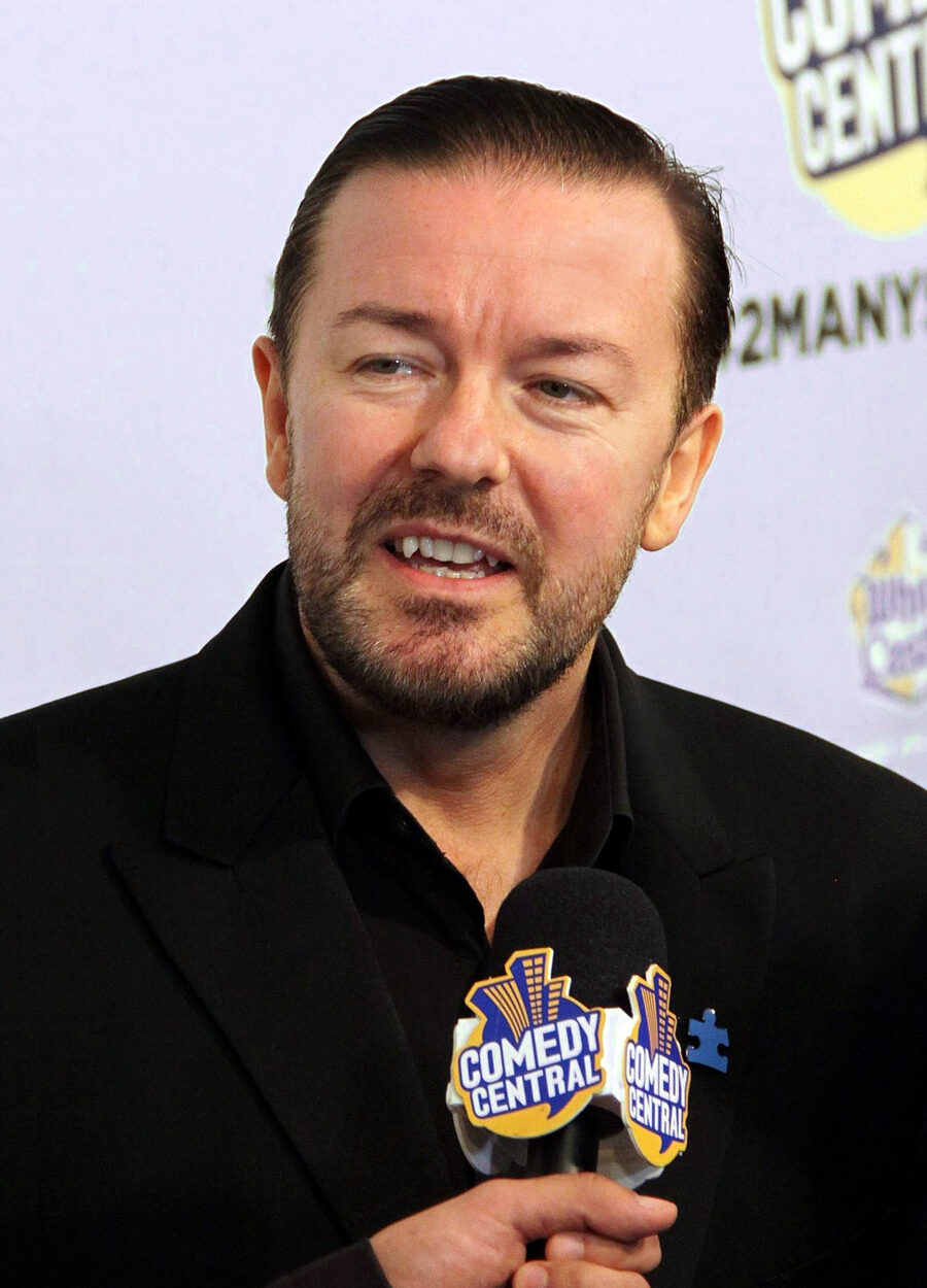 Ricky Gervais speaking onstage in 2010
